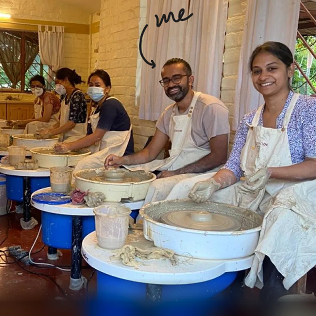 Cyril at a pottery wheel in a workshop, marked "me" in the photograph.